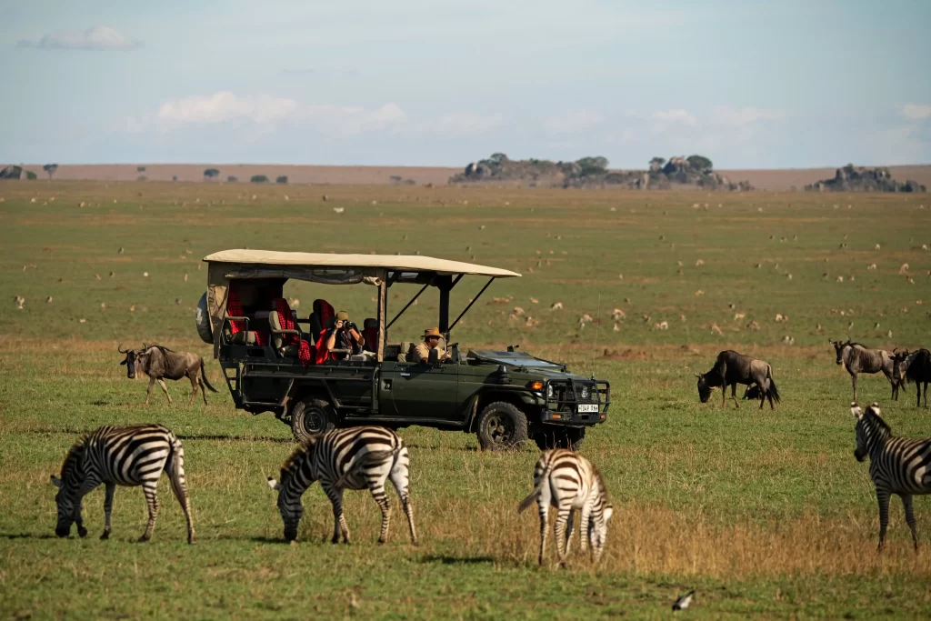 Tourists of American descent on game drive in Serengeti National park