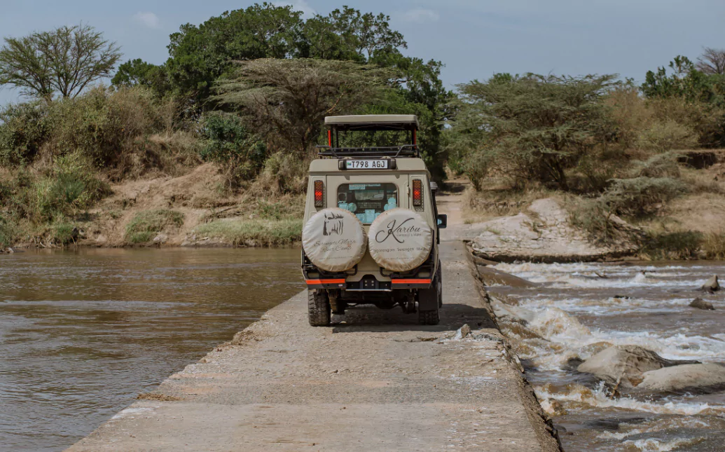 Karibu camps truck crossing the Mara river bridge